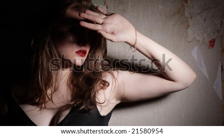 Portrait of Beauty Girl with Red Lips. Grunge Wall