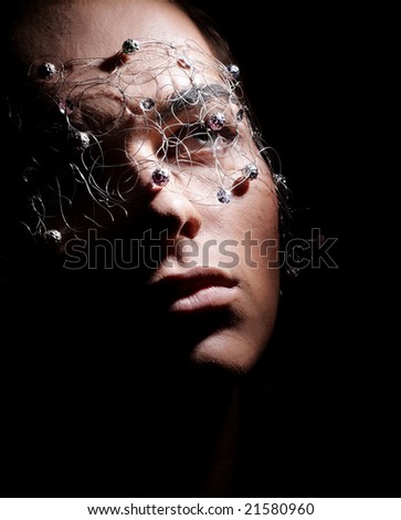 Artist Man in Mask Isolated over Black. Close-up Portrait