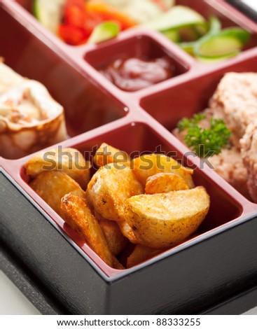 Japanese Meal in a Box (Bento) - Potatoes, Steamed Cutlet and Sweet Fruit Sushi