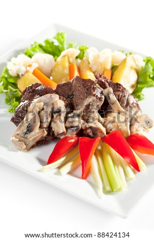 Meat Medallions with Mushrooms Sauce and Vegetables