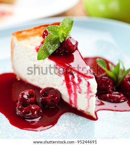 Dessert - Cheesecake with Berries Sauce and Green Mint - stock photo