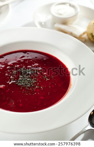 Beetroot and Cabbage Soup with Meat Slice. Garnished with Bread, Lard and Sour Cream