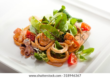 Various Seafood Salad with Freshness Green Leaf and Cherry Tomato