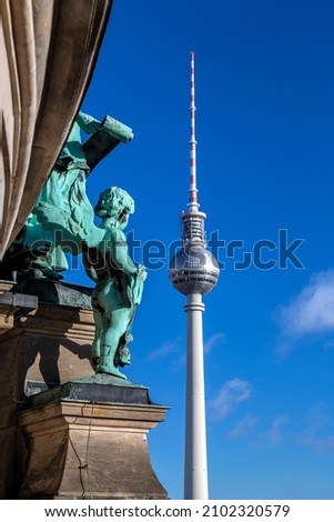 Similar – Image, Stock Photo Berlin television tower at Alexanderplatz and street lamp in historical style parallel and reflecting the sunlight against the blue sky with partly light cloud cover