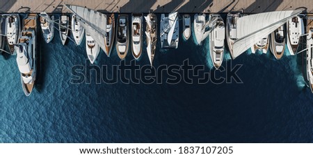 Aerial view of the yacht club. Aerial top-down view of docked sailboats. Top down view of yachts. 3d visualisation