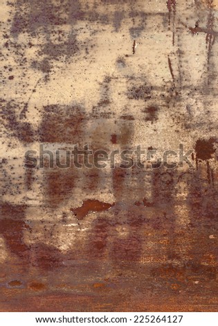 Industrial rusty metal background texture with flaking and peeling paint, yellowish red