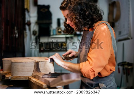 Similar – Image, Stock Photo Instrument maker working with hair for bow