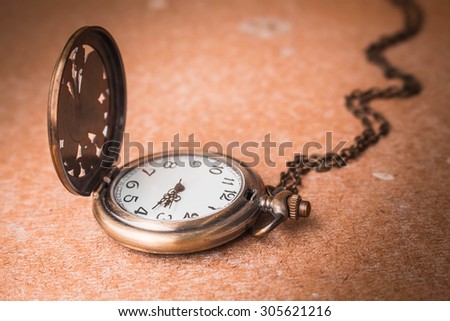 Stopwatch on a lonely old wooden floors.