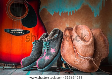 Old hat and shoes on a wooden floor in tourism