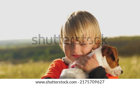 Similar – Image, Stock Photo Kids hugging dog on beach