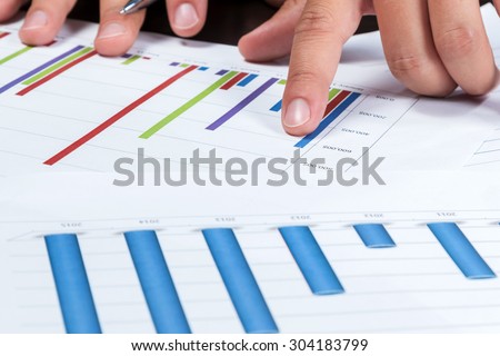 Hand of businessman showing the index finger on the color chart