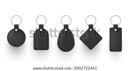 Realistic black leather keychains with metal ring vector illustration. Set of holder trinket to key fob for home, car or office isolated. Template blank accessory for corporate identity branding