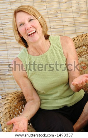 Natural senior woman smiling in a natural interior.
