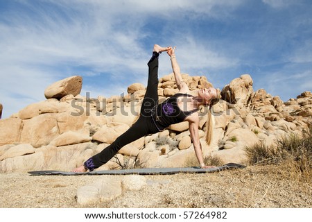 Woman in yoga plank pose outdoors.
