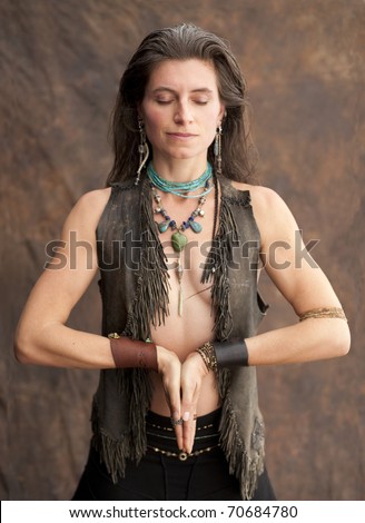 Wild Prayer. Beautiful wild spirit woman in shamanic yoga prayer.