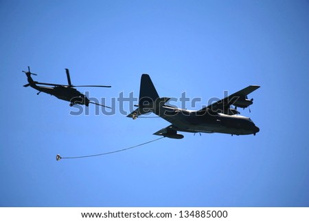 Cargo plane getting refueling in mid air