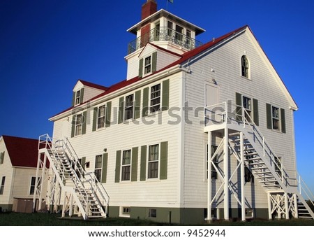 Older two story house with blue sky