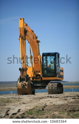 backhoe with blue clear sky