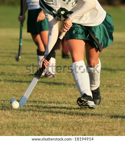 Field hockey player with ball