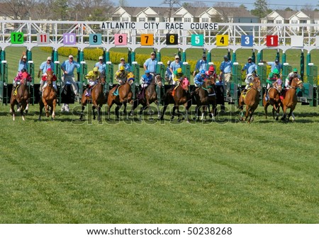 MAYS LANDING, NJ - APRIL 23: Jockeys with their horses come down the home stretch April 23, 2009 in Mays Landing, NJ.