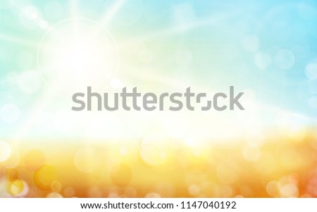 Autumn background, blurred light dots, blue sky with sun rays. Great background for any nature theme.