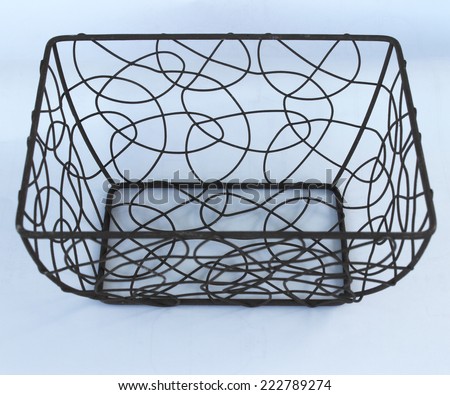 Old iron basket used for carrying everything on your office desk.