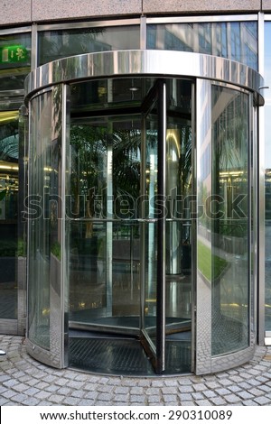 Modern revolving door as entrance to office building or hotel