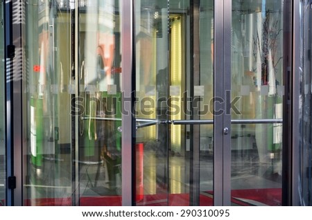 Modern revolving door as entrance to office building or hotel