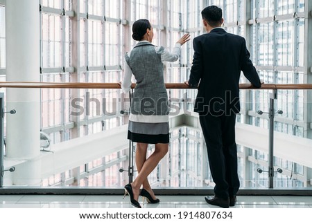 Similar – Image, Stock Photo Anonymous person standing looking at islet with coniferous trees in lake