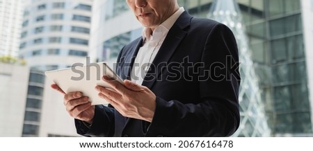 Similar – Image, Stock Photo Anonymous businessman working on the compute in city