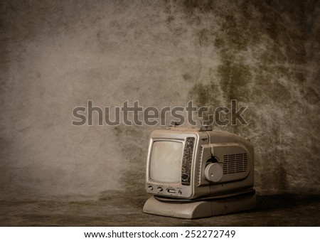 Old tv with grunge background