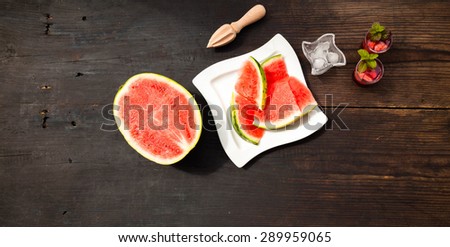 Cooking of watermelon drink, top view, wooden background