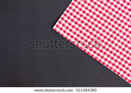 Black, red and white tablecloth, texture background, top view