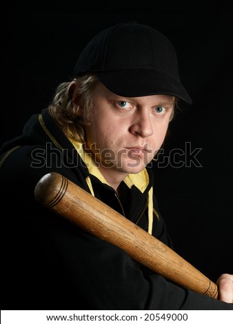 Man\'s full-face portrait with baseball bat against a black background.