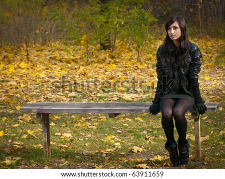 Alone Young Girl Sits On A Bench In Autumn Park Stock Photo 63911659 ...