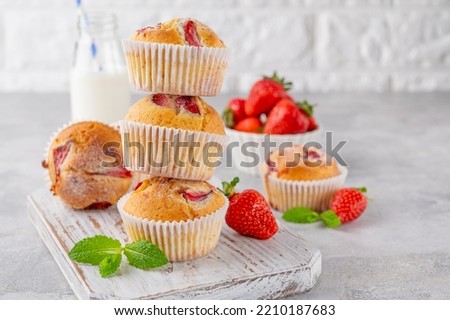 Image, Stock Photo Eating a strawberry muffin. Woman hands holding a muffin. Fruit dessert