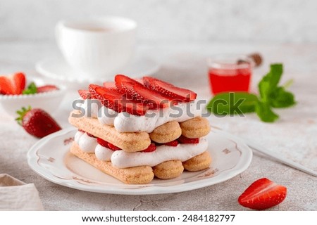 Image, Stock Photo Strawberries tiramisu on a field of daisies in spring