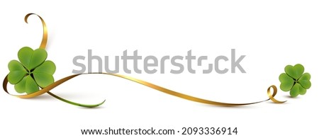 Elegant golden ribbon with two four leaf clovers. Banner with copy space