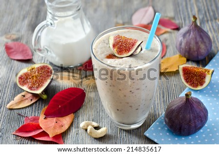 Healthy beverage in autumn wooden background