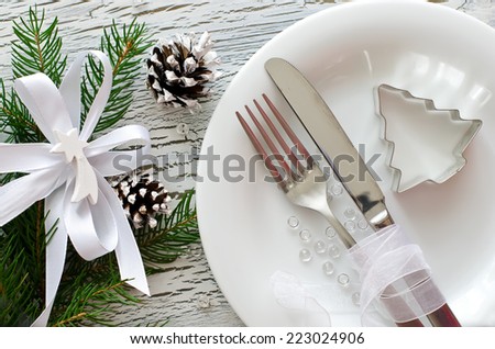 Christmas dinner invitation on wooden white background