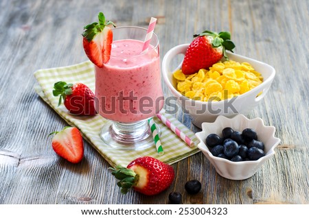 Fresh healthy breakfast with berries and milk shake selective focus
