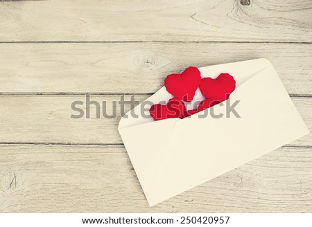 vintage love Letters,Red Hearts in a letter on wood