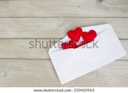 love Letters,Red Hearts in a letter on wood