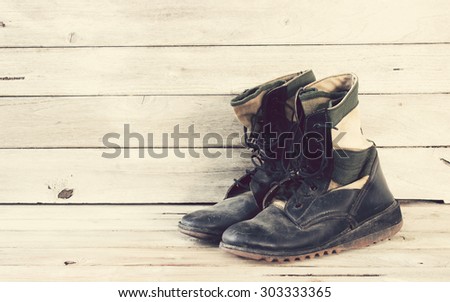military boots on wood