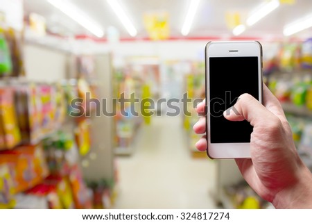 Mobile hold in hand with Blur Department store