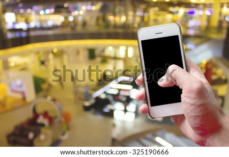 Mobile hold in hand with Blur Department store