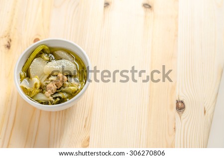Chinese vegetable stew, mixture of vegetables and pork on wooden background