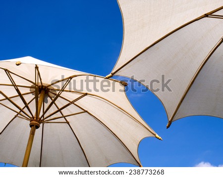 White large umbrella under blue sky