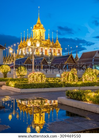 Metallic castle left only one in Bangkok, Thailand, last place in the world, under twilight evening sky with reflection from water