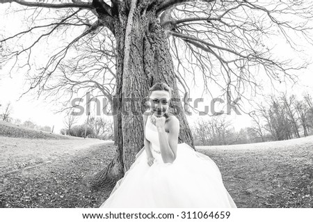 an image of groom and bride at the tree